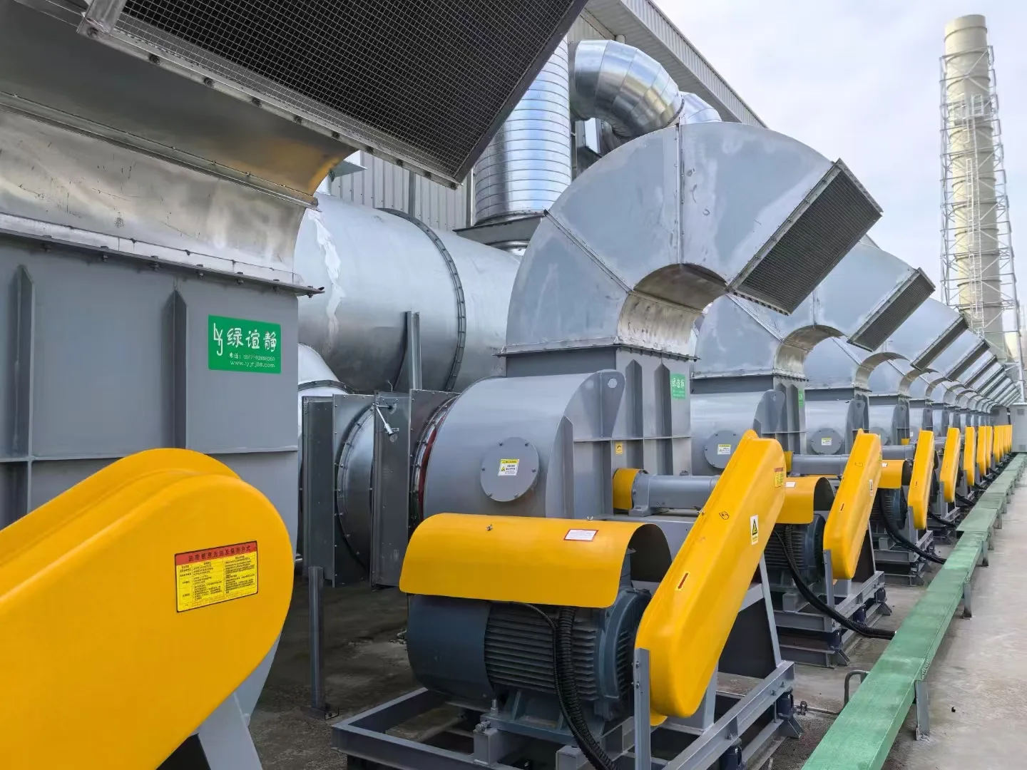 Outdoor centrifugal fan assemblies with externally mounted motors and yellow transmission guards, shown in the July 2024 Jiangsu Lvyijing project.